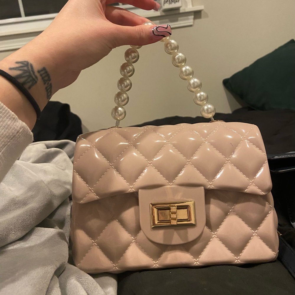 Pink Jelly Purse, pearl handle plus a gold shoulder chain.